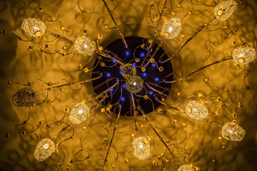 Beautiful luxury ceiling chandelier in the lobby of a public place.