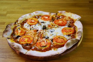 Vegetarian pizza in wooden tray