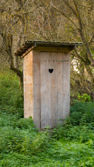 isolated wooden dry toilet