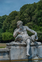 Fototapeta na wymiar Statue fountain of Cerere Royal Palace gardens in Caserta