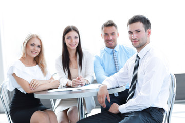 business team sitting at a table in a cafe.