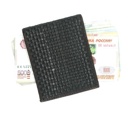 Banknotes stacked in a male leather wallet on a white background