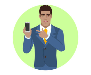 Businessman pointing at a mobile phone