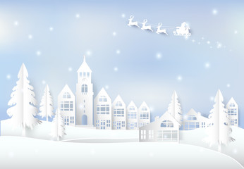Winter holiday Santa and snow in city town blue sky background. Christmas season paper art