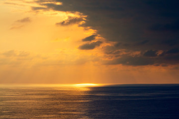 Fototapeta na wymiar Sunset over the sea. Seashore with beautiful picturesque sky
