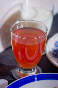 glass of tea flavored with citrus fruits