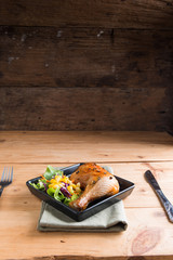 Roasted chicken leg with sauce and black pepper