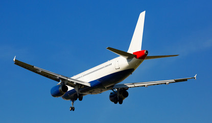 Fototapeta premium Passenger plane departing in afternoon