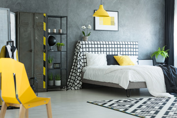 Yellow designer chair in bedroom