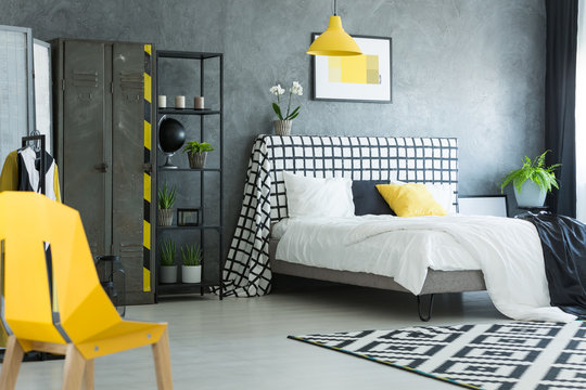 Yellow designer chair in bedroom