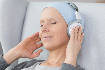 Cancer survivor listening to music
