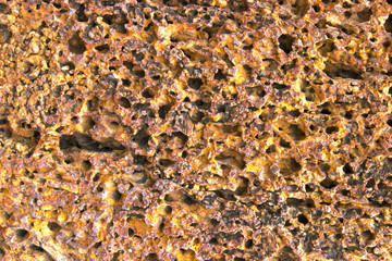 Abstract background of laterite stone wall. Texture surface of laterite stone wall.