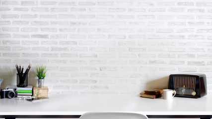 Contemporary desk Workplace with vintage camera, vintage radio, coffee cup and gadget white wood table. Desk space Concept. Desk space background.