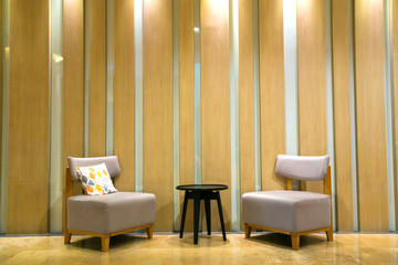 Modern interior of living room with two armchairs and side table