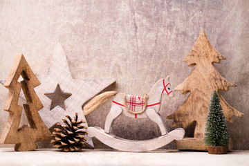 Christmas tree decorations on a wooden background. With bokeh ornaments.