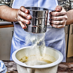 Woman Chef sifts flour, knead the dough. Concept: bakery, baking. View from above
