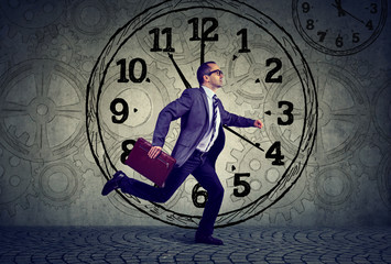 Mature business man in suit running on time