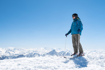 Fototapeta na wymiar Man skiing on snow