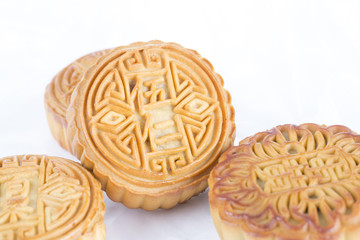 Mooncake isolated on the white table. Chinese mid autumn festival food. 