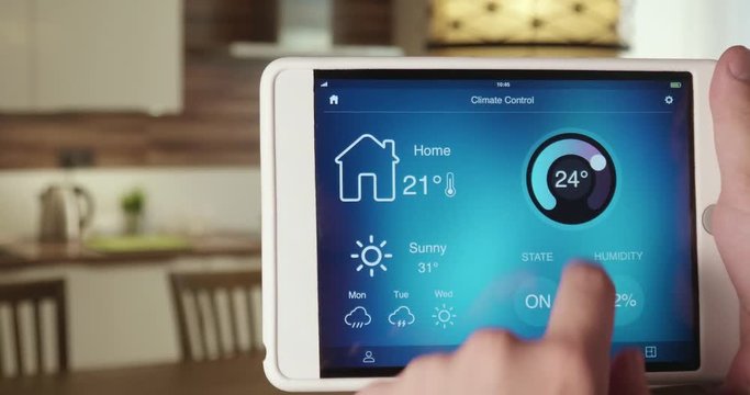 Controlling temperature in the house using app on the digital tablet