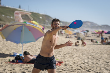 One man playing tennis beach