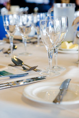 Luxury restaurant table with plates and glasses set