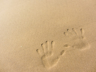 playing with sand long the shoreline