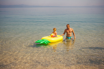 Father and child. Pool. Sea background. Child. Childhood. Kids. Kid. Happy family day. Family. Vacation.