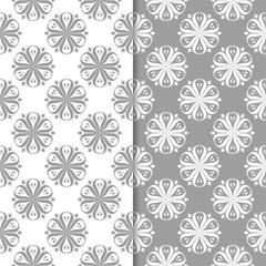 White and gray floral backgrounds. Set of seamless patterns