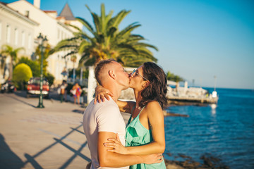 Fototapeta na wymiar Kissing couple. Man and woman kissing. Happy day. Sensual. Sea beach. Dream Lifestyle.