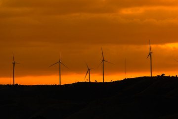 Electric turbine on the mountain at sunset