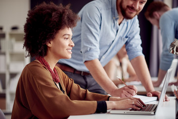 Multi ethnic team working at modern office space