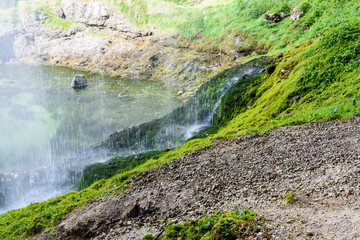 Dreamy waterfall and small emerald pond. Karst water. Fontanon of Goriuda. Friuli