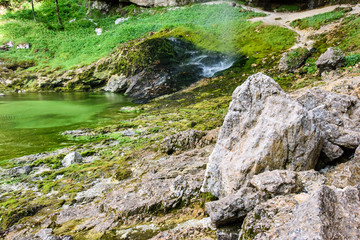 Naklejka na ściany i meble Dreamy waterfall and small emerald pond. Karst water. Fontanon of Goriuda. Friuli