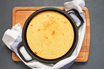 Cakes, manna in the baking dish on the kitchen table. The view from the top