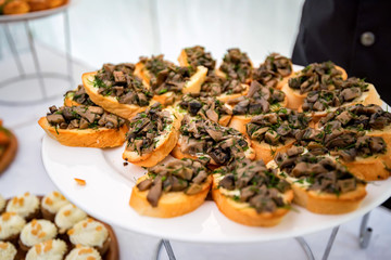 Close up bruschetta with fried mushrooms