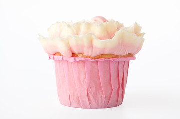Pink cupcake with white whipped cream in form of flower on white background. Picture for a menu or a confectionery catalog. Cutout.
