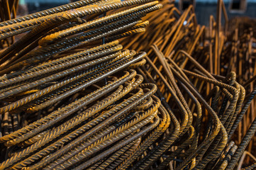 Stacked reinforcement steel foundation bars on construction site 