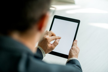 Businessman Typing on digital tablet