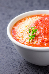 Roasted tomato and basil soup. Selective focus, space for text.