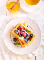 Waffles with sour cream, berries
