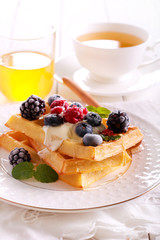 Waffles with sour cream, berries