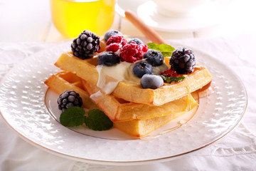 Waffles with sour cream, berries