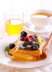 Waffles with sour cream, berries