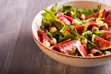 Figs, rocket, ham and nut salad
