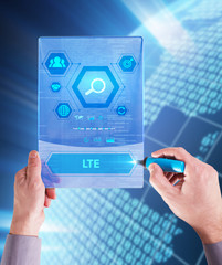 The concept of business, technology, the Internet and the network. A young entrepreneur working on a virtual screen of the future and sees the inscription: LTE