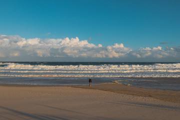 One person looking towards the beach.