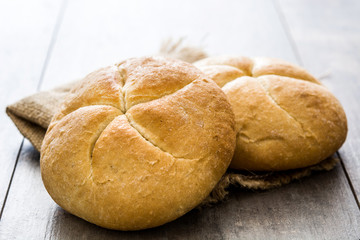 Round rustic bread on wooden table