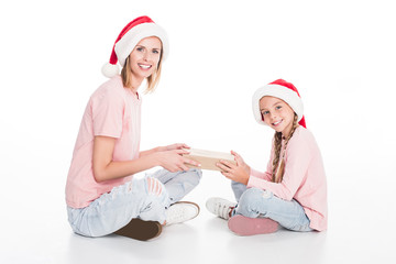 mother and daughter with gift on christmas