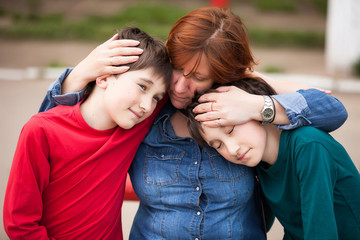 Fototapeta premium mother with sons twins